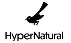 A simple black silhouette of a bird stands above the word HyperNatural in bold, black text on a white background, designed by Chris Kolbe.