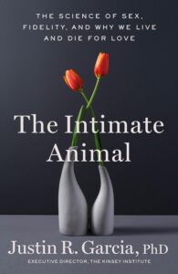 Cover of The Intimate Animal by Justin Garcia, PhD, featuring two red tulips in intertwined gray vases against a dark background, with white text about the science, sex, and love explored by Justin Garcia.